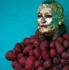 man to head in red potatos