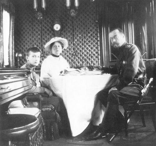 Emperor Nicholas II, Empress Alexandra Feodorovna and the Tsesarevich.  Saloon car of Imperial train. Apprx. 1903. 